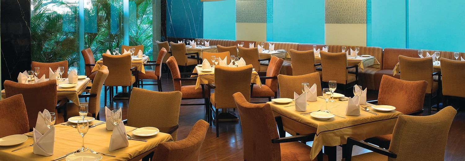 Shot of magnolia, our multi-cuisine restaurant with several seating arrangements | Mirage Hotel