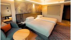 Serene Deluxe Twin Room with Soft Lighting