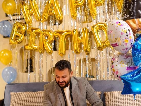 A man celebrating his birthday at Themis Mudhouse - A Nature's Retreat Resort & Wellness