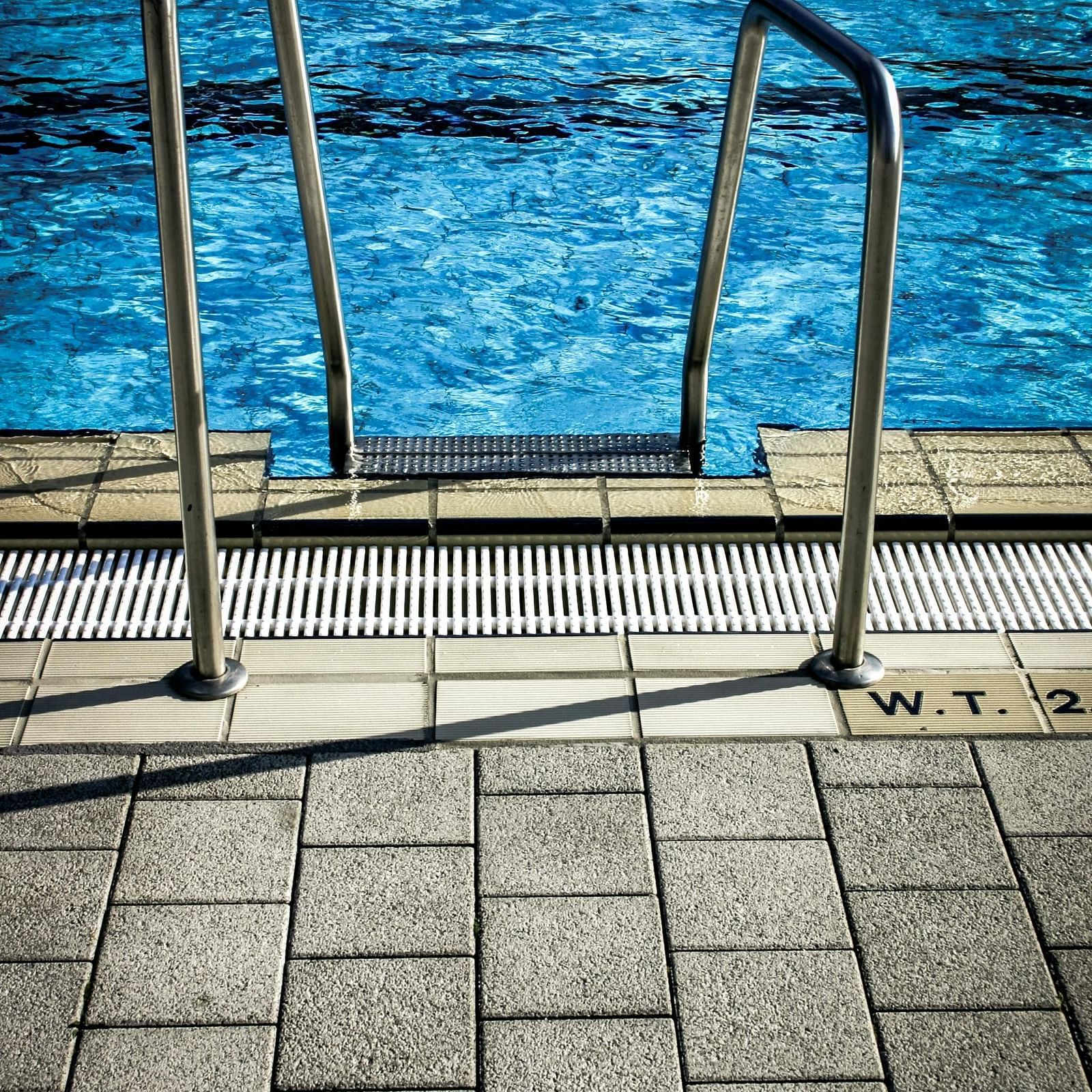 White Metal Railings Near Swimming Pool