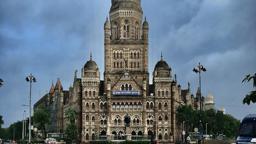the brown building of Chhatrapati Shivaji Maharaj Terminus during monsoon
