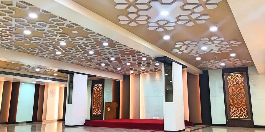 an empty Banquet Hall in Tirupati with many lights switched on - Raj Park Hotel, Tirupati