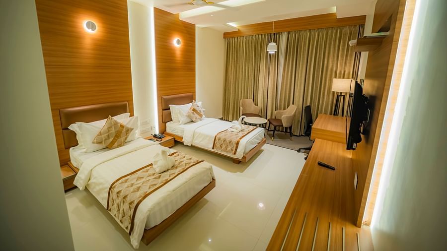 A full view of Deluxe Twin Room with twin beds and bedding