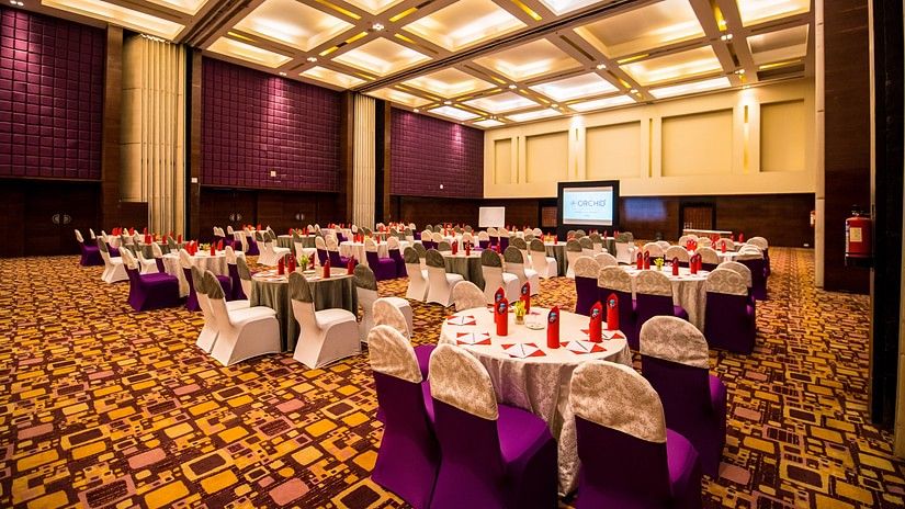 hotel banquet halls with purple chairs - The Orchid Hotel Pune