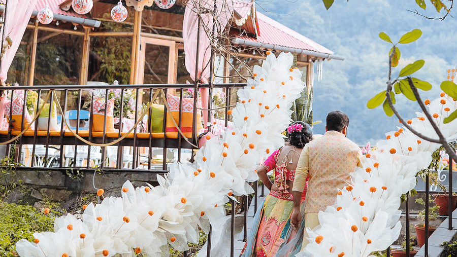 A decorated outdoor structure, possibly a gazebo or tent, with a person walking on a decorated path.