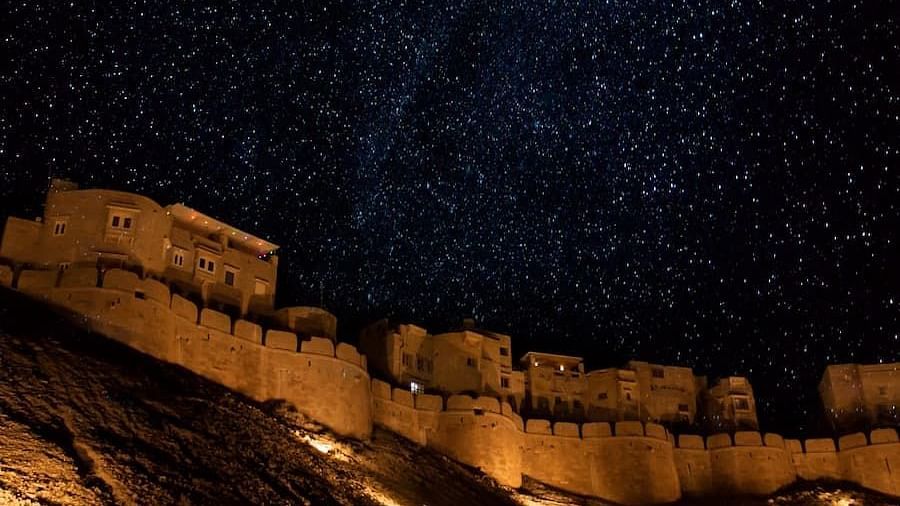 Mehrangarh Fort at night with the light on and under the stars