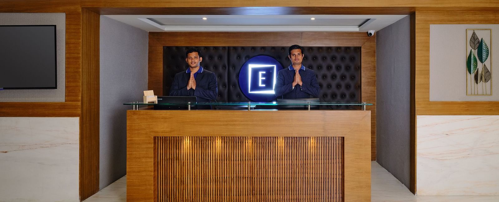 Reception desk in the lobby area of Essentia Premier Hotel, Chennai