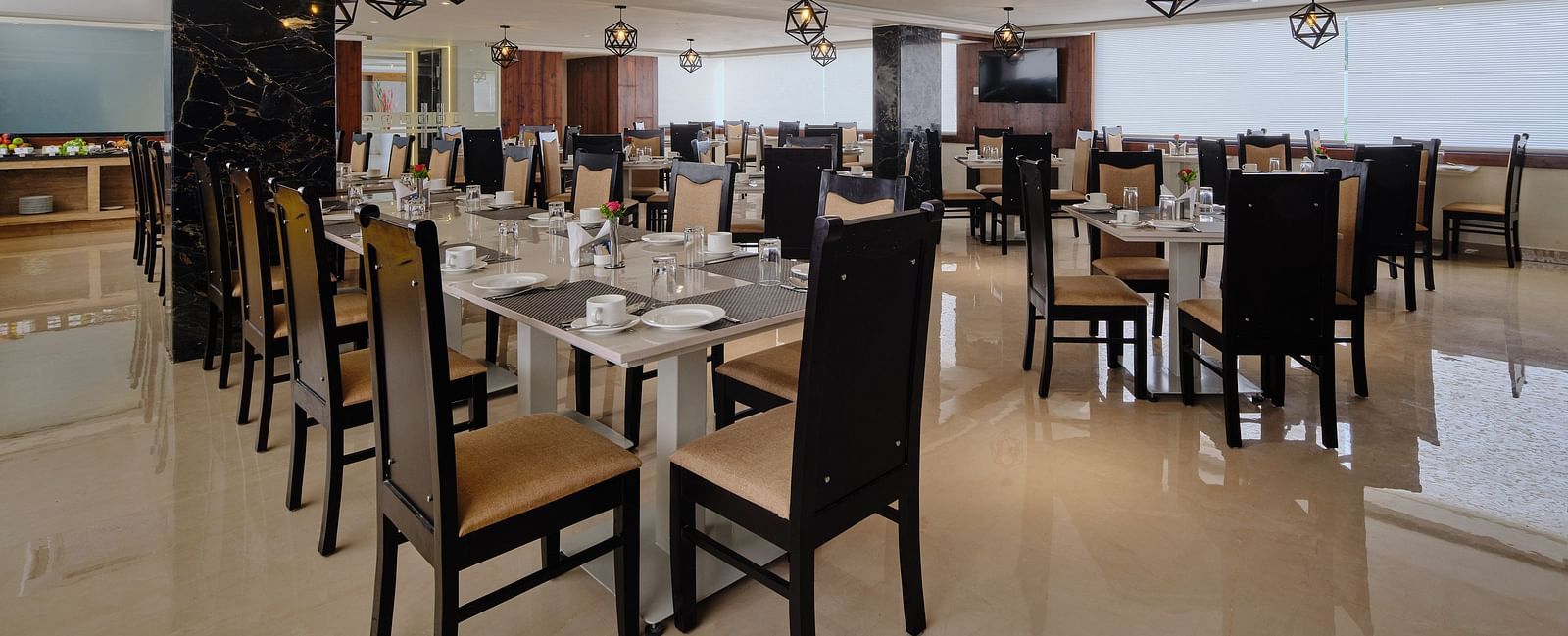 Dining arrangement at Blue Salt and Coffee at Essentia Premier Hotel, Chennai