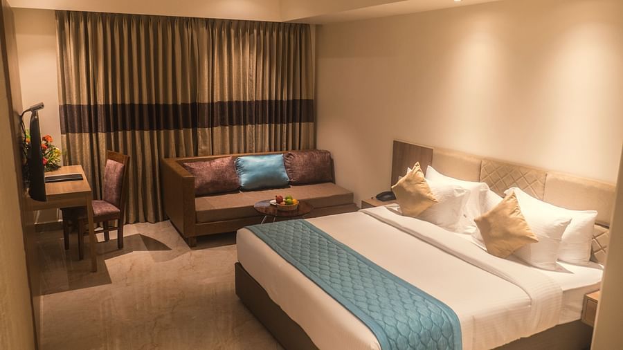 view of a king size bed of Luxury Sea View Room