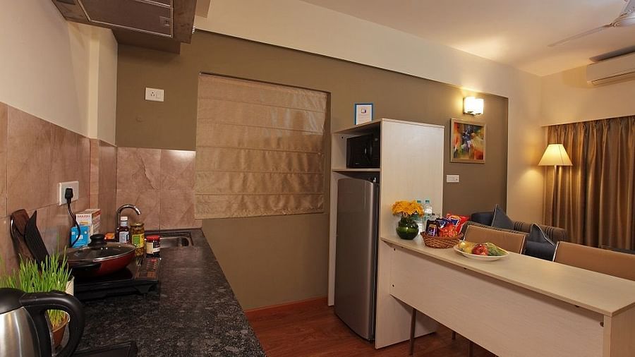 Kitchenette area of the room at Starlit Suites, Bangalore