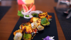 A plate containing barbeque with vegetables | The Bristol Hotel