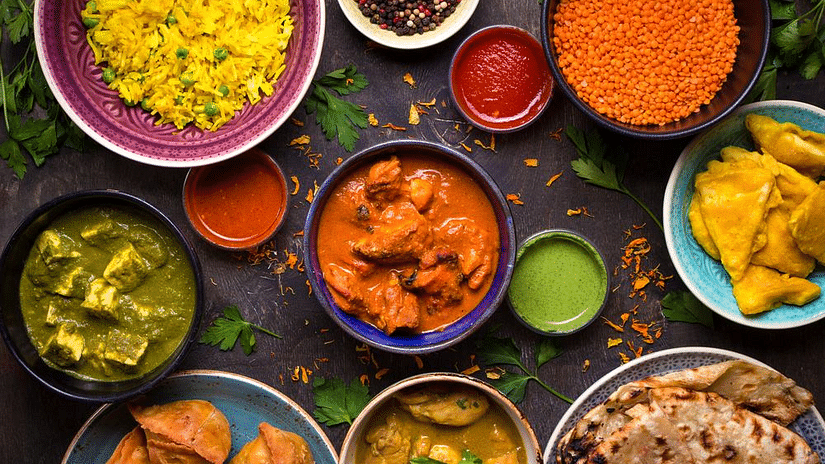 A table full of indian delicacies as seen from above