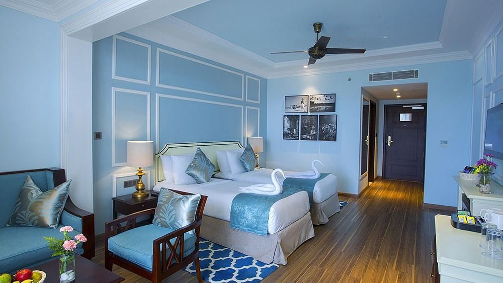 Spacious bed with neatly arranged cushions