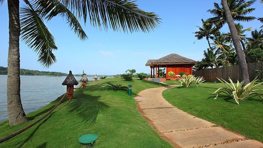  A balcony setup overlooking the lake with a scenic natural view, accessible via a pathway leading to the area