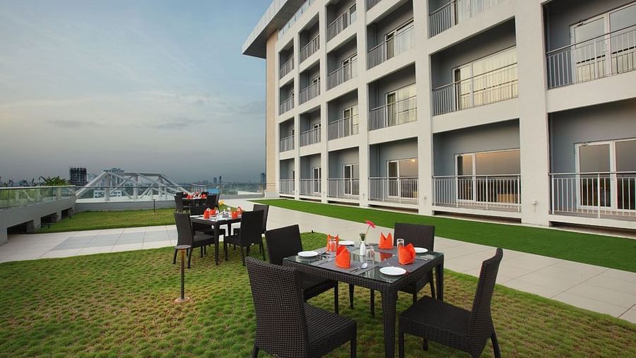 A close up shot of seating arrangement on the terrace - Starlit Suites, Kochi