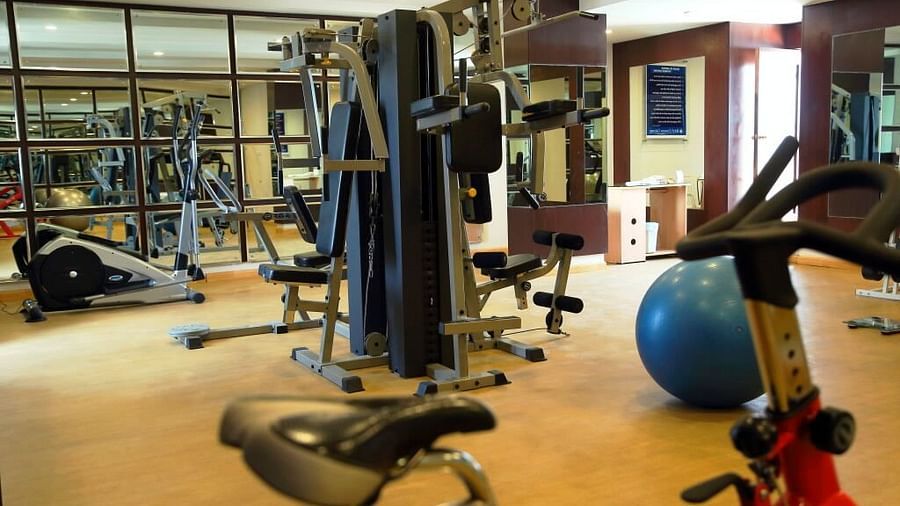 A gym filled with various equipment and bright lighting | Cenneys Gateway