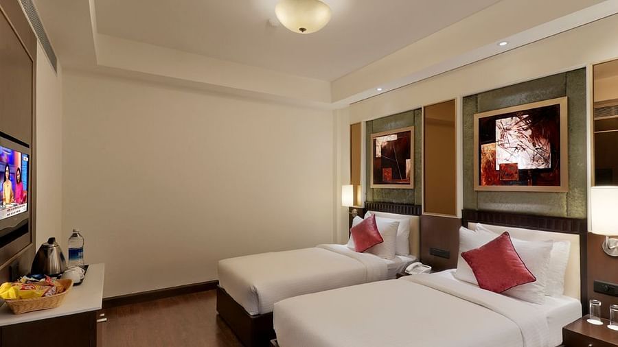 view of twin bed in Premium twin room of Inde Hotel Vista Woods, Gurgaon 