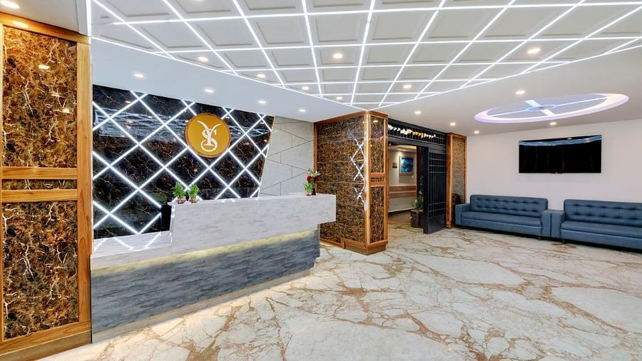 An image of the lobby at Yashshree Sikkim Blossom, Gangtok featuring the seating area with sofa sets and the reception