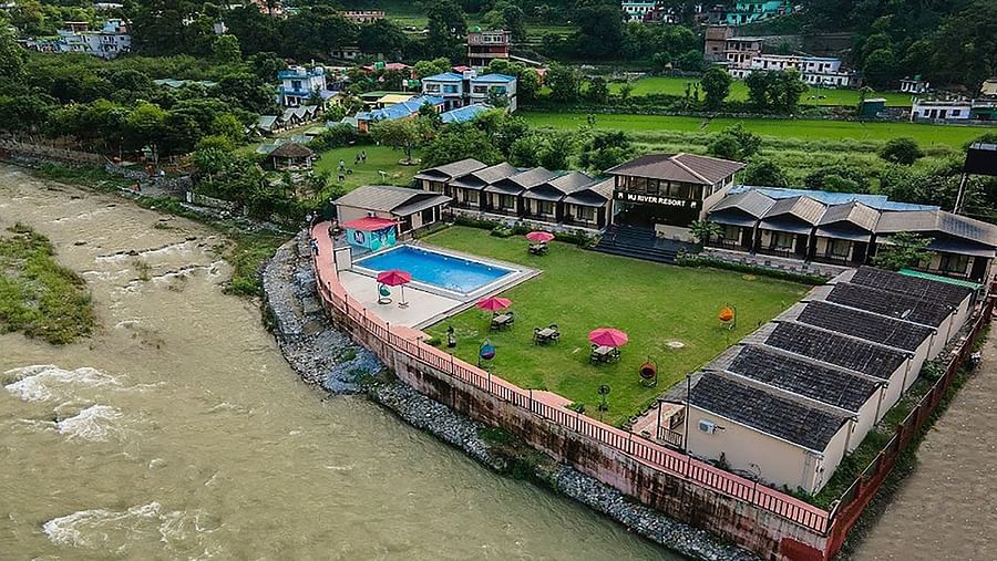 Aerial view of DLS MJ River Resort, Rishikesh during the day.