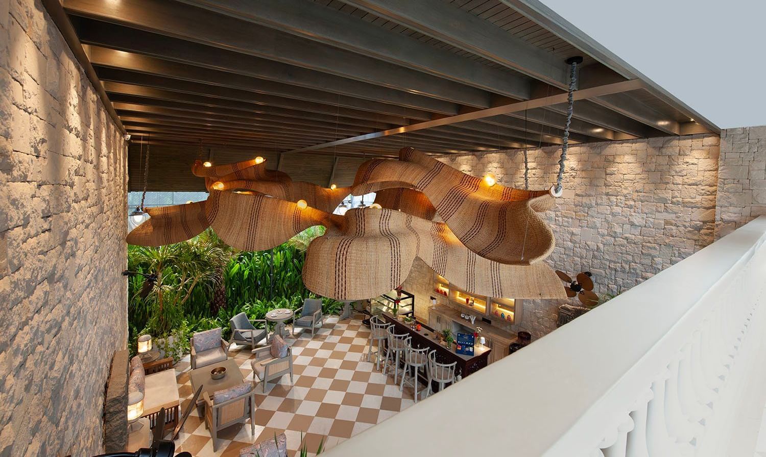 Full view of Suenos de Cafe taken from a higher level featuring an expansive dining area with ample of natural light falling over it.