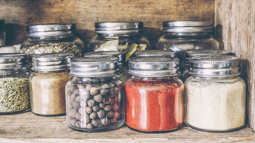 jars containing assorted condiments and spices