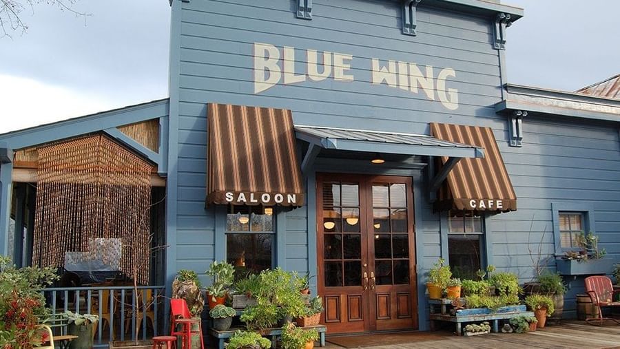 The inviting entrance of the Blue Wing Saloon, a delightful dining option connected to the Tallman Hotel.