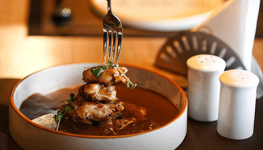 alt-text Indian Cuisine Served in Traditional Bowls with a fork