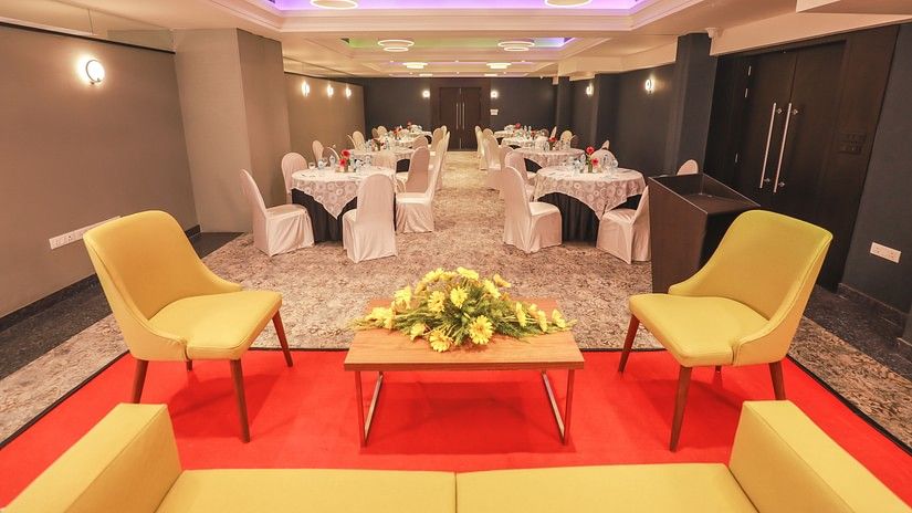 hotels with banquet halls in Bhubneshwar with yellow chairs