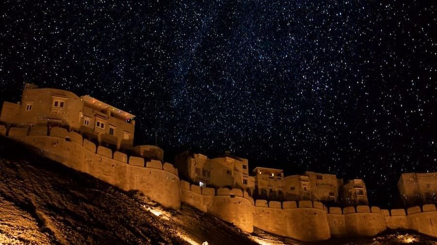 Mehrangarh Fort at night with the light on and under the stars