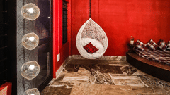 The banquet hall at Woodstock Farmhouse, Shillong, featuring a swing, and lights.