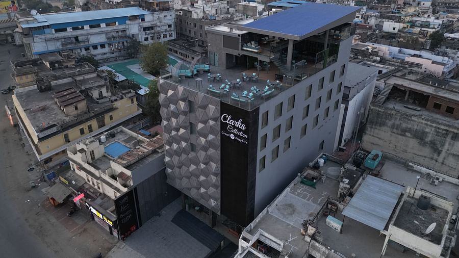 A long shot view of Clarks Collection Grand Sapphire, Ajmer, surrounded by multiple buildings.