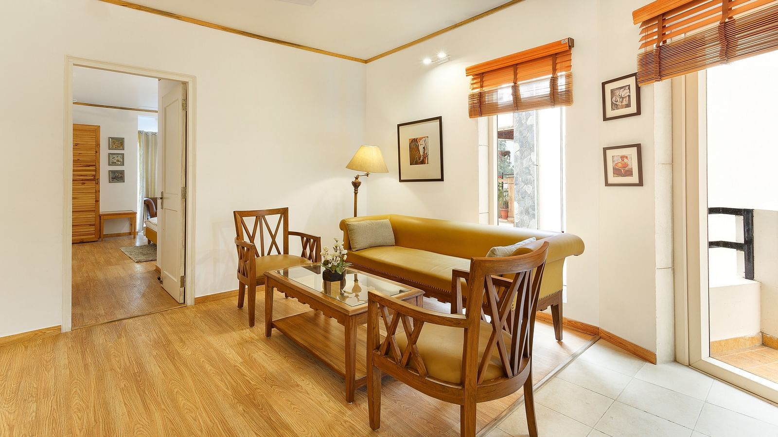 Leaving Area with chair and comfy sofa with a lamp - Pinewood Nainital 