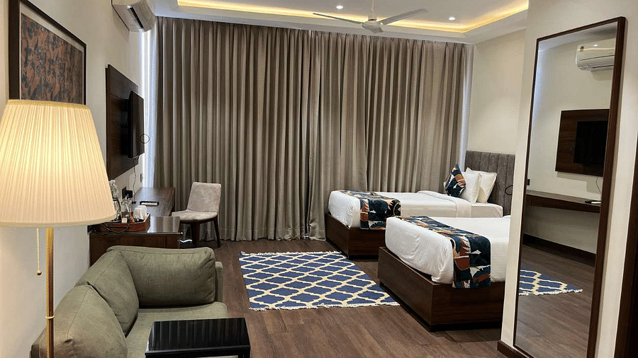 premium city twin bed room with 2 single beds and TV at Aura Boutique Hotel, Udaipur