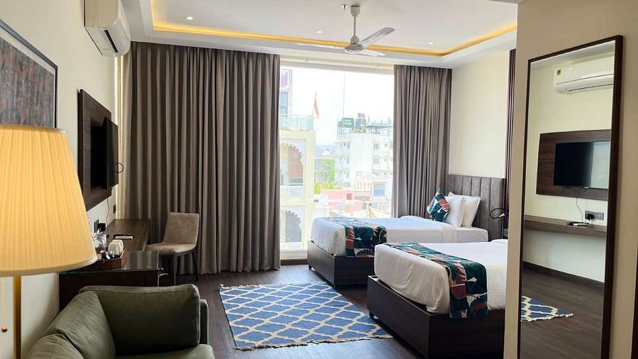 premium city twin bed room with 2 single beds and TV at Aura Boutique Hotel, Udaipur 