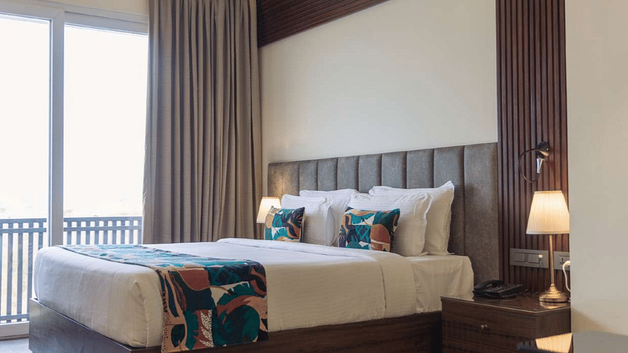 premium palace view  room with king sized bed and TV at Aura Boutique Hotel, Udaipur
