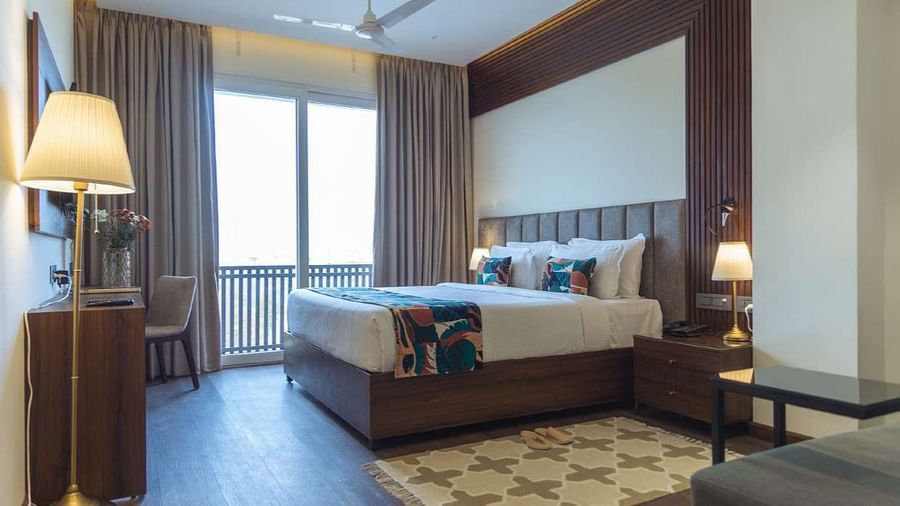 premium palace view  room with king sized bed and TV at Aura Boutique Hotel, Udaipur