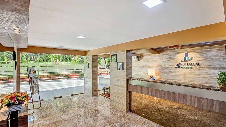 A wide shot of the entrance and reception of Maxxvalue Apartment, Marol