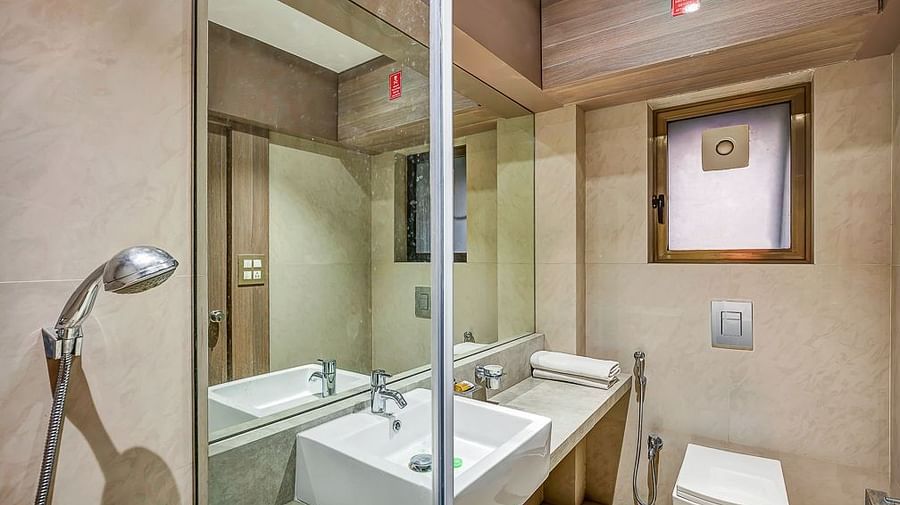 A picture of a mirror and sink in the bathroom