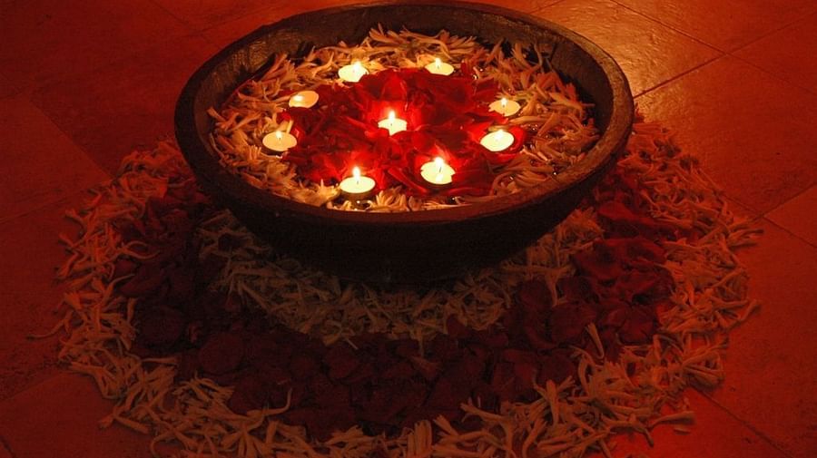 Image of a pot with flowers and diyas at Couple Spa Room at IOSIS Spa & Wellness