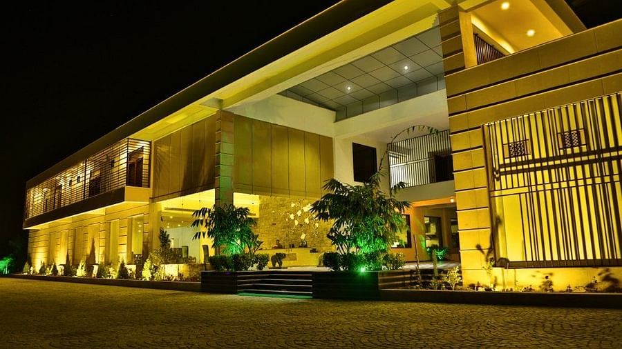 Exterior view of a big building fully lightened up during night - Clarks Safari, Ranthambore