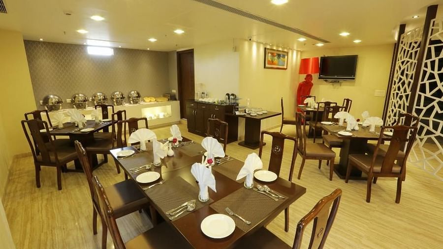 A restaurant with several tables and chairs - Five Elements Hotels