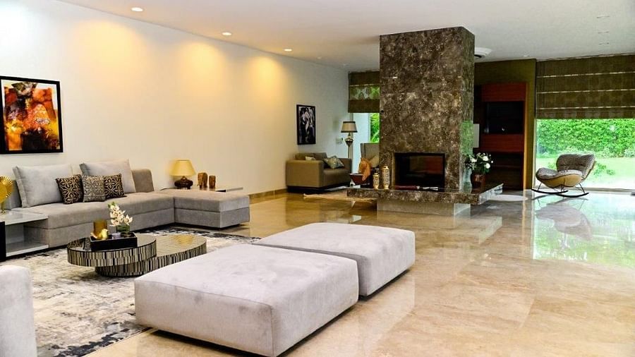 A wide angle shot of the entrance of our villa featuring a large open space with seating area all around   Udman Luxe Villa