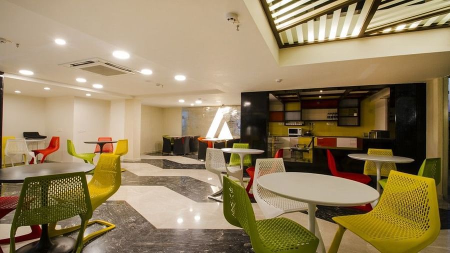 Dining area with tables and chiars at  Art Boutique Hotel, Hyderabad 