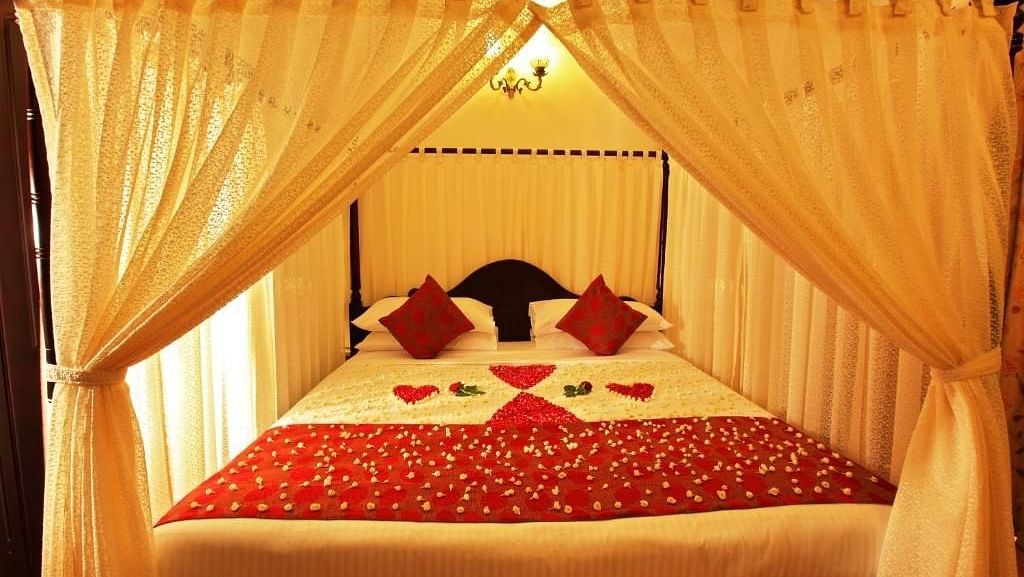 Bed warmly made with decorations and inviting lighting, set for a restful night