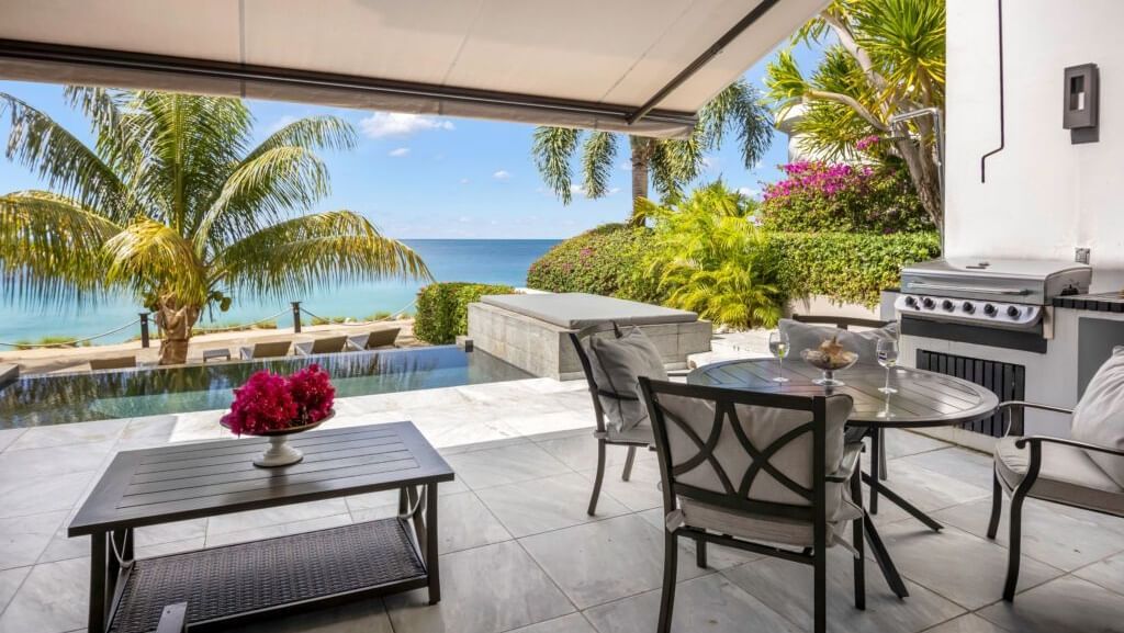 Private outdoor patio with dining area, BBQ grill, and oceanview plunge pool at Tamarind Hills Resort and Villas, Antigua.