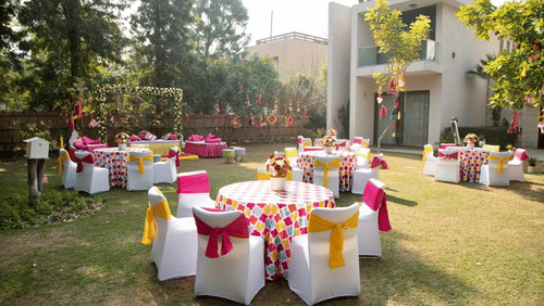 An overview of the outdoor seating arrangement for a wedding reception - Karma Lakelands.