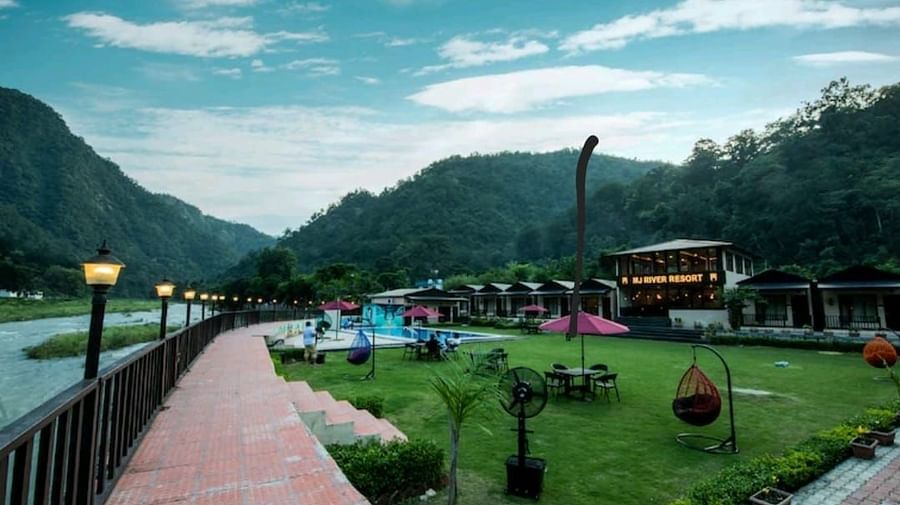 A far-angle view of DLS MJ River Resort, Rishikesh with a garden view .