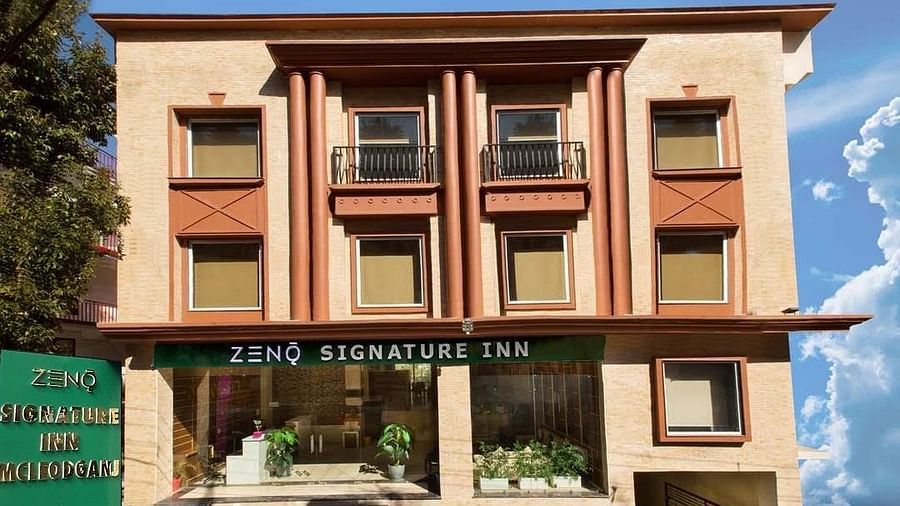 facade image of the ZENQ SIGNATURE INN, MCLEODGANJ with a beutiful blue sky in the background