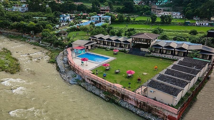 Aerial view of DLS MJ River Resort, Rishikesh during the day.