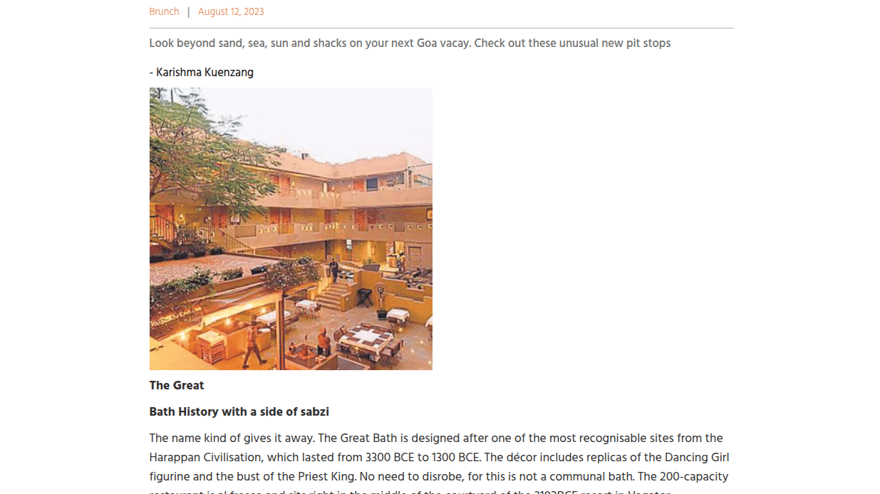 Outdoor dining courtyard at 3102BCE resort in Vagator, inspired by Harappan architecture with seating and warm ambient lighting.